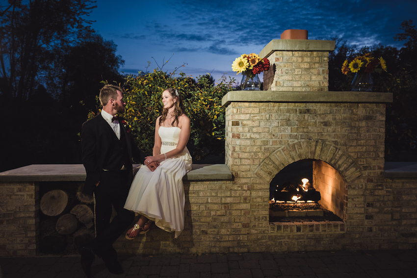 fenton winery bride and groom fireplace