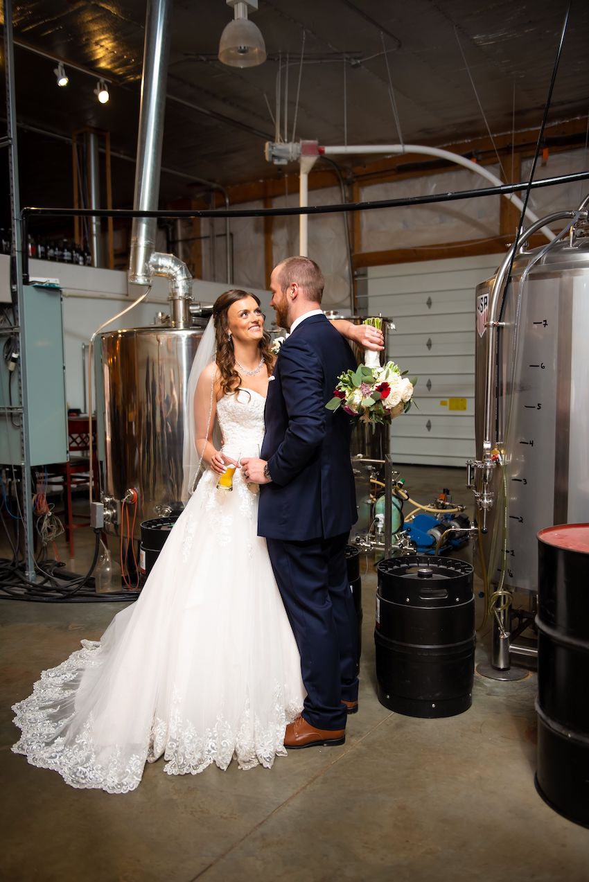 fenton winery bride and groom in brewery