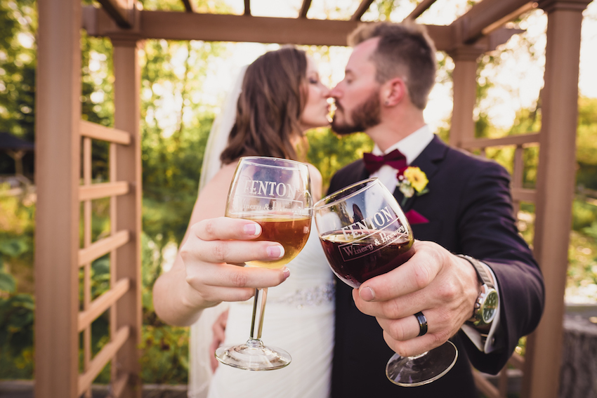 fenton winery bride and groom toasting wine