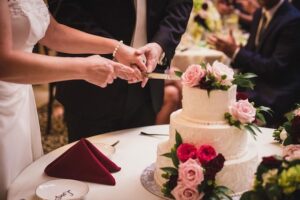 cutting-3-tiered-cake-with-floral-details