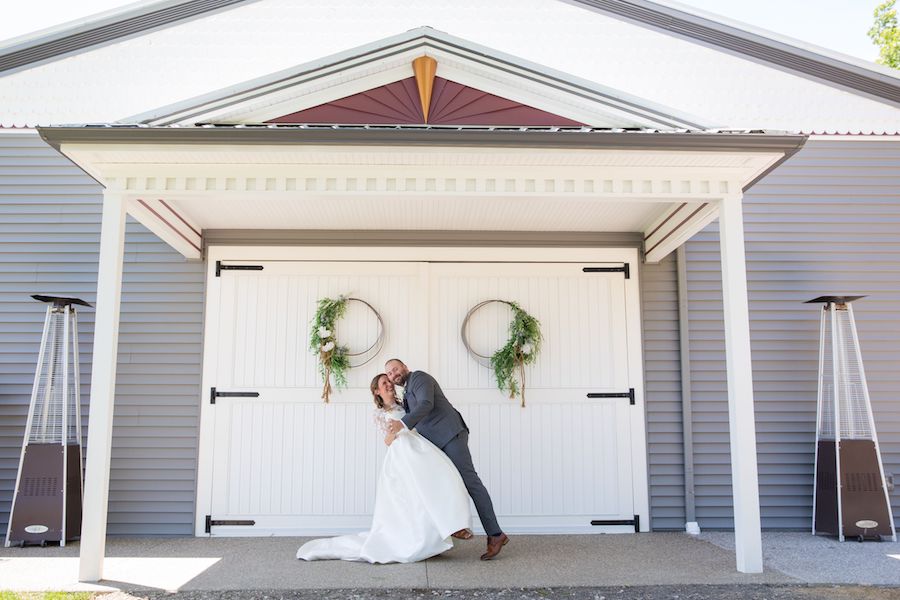 The Oakley Wedding Venue barn doors couple dipping