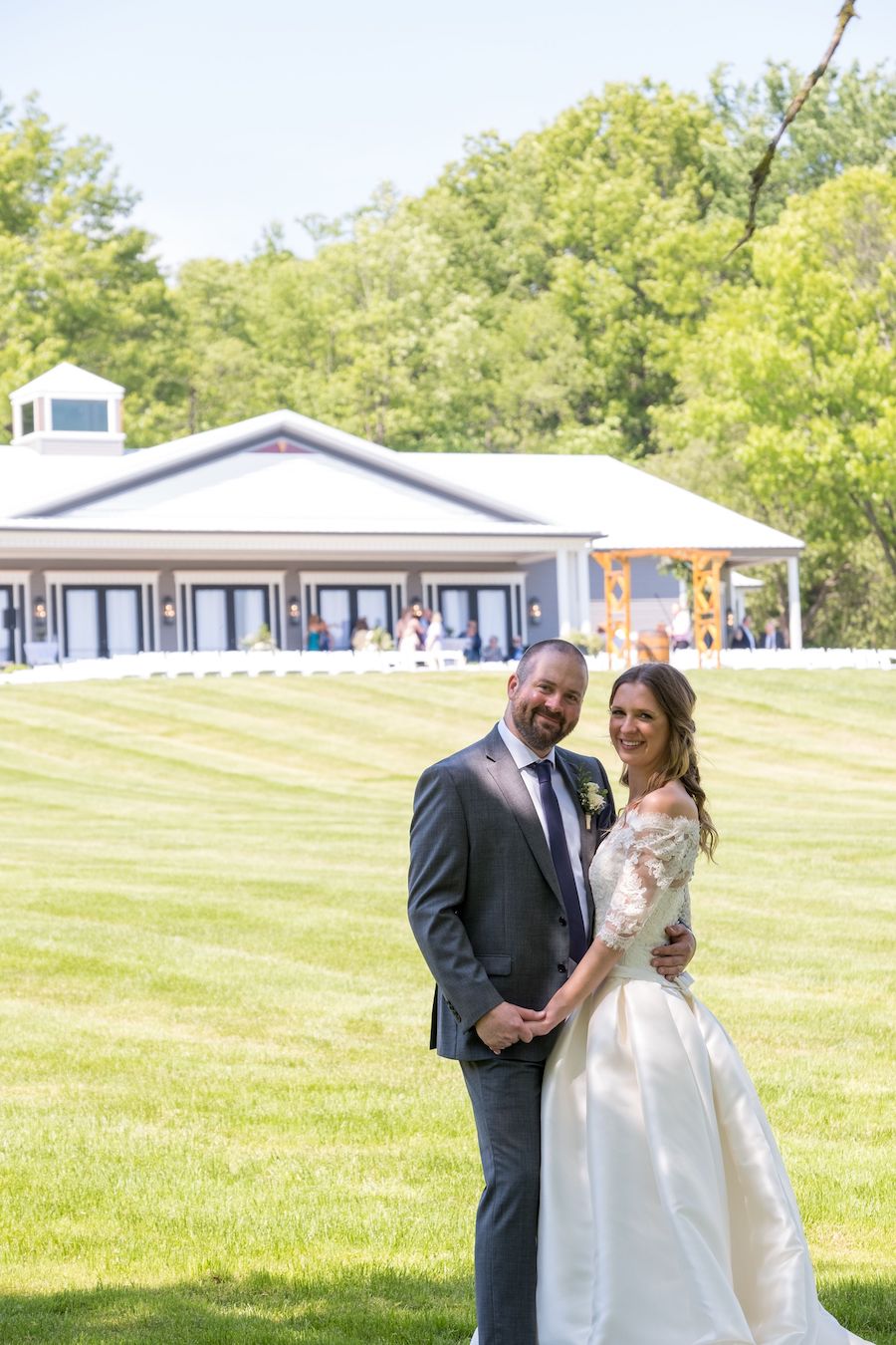 The Oakley Wedding Venue bride and groom outside hall