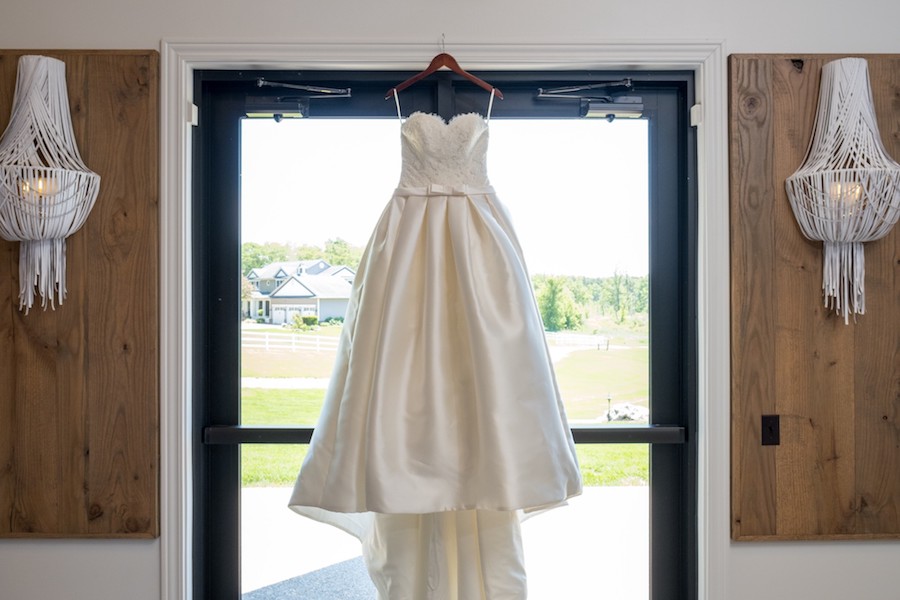 The Oakley Wedding Venue dress hanging barn door