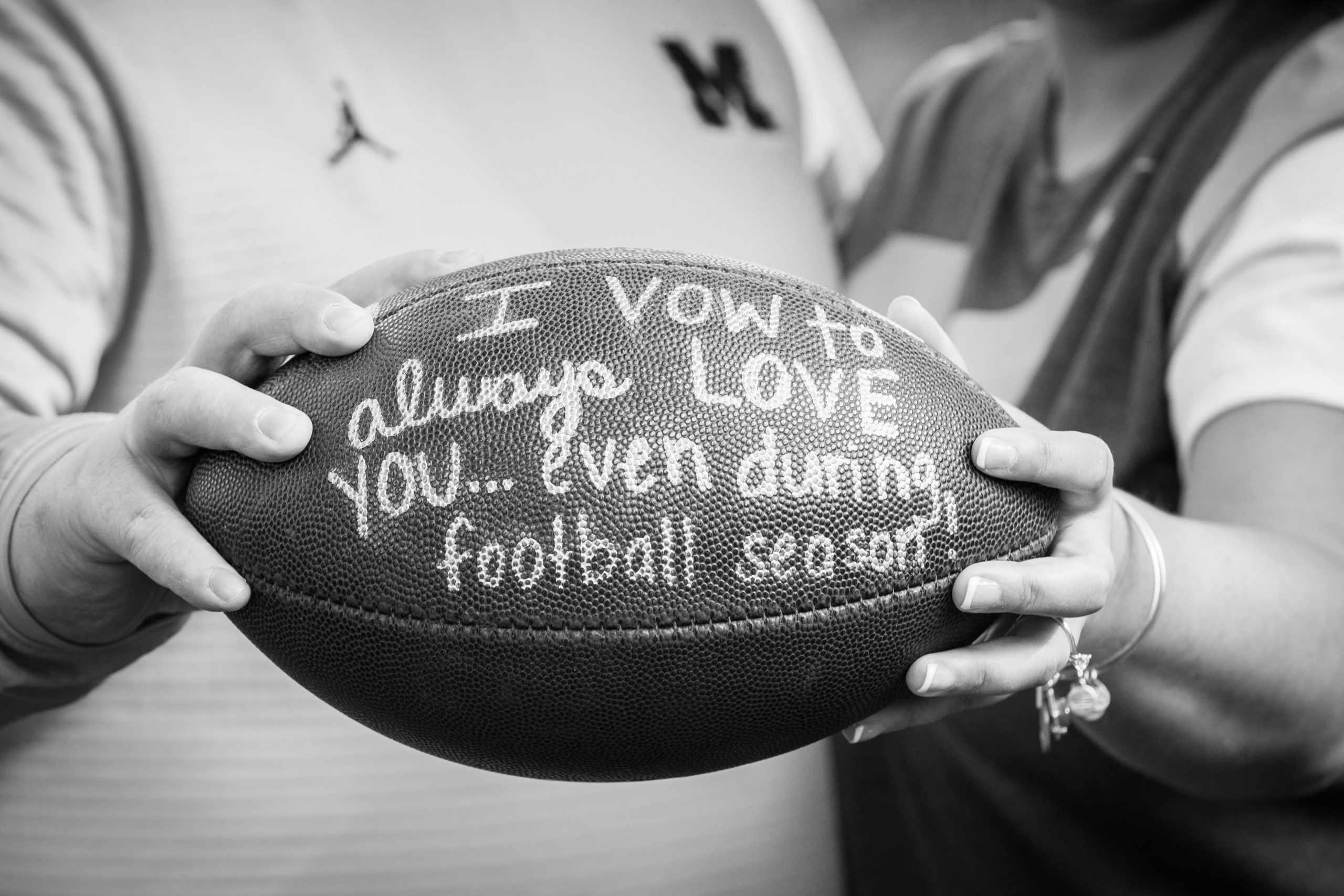 football prop in engagement photo