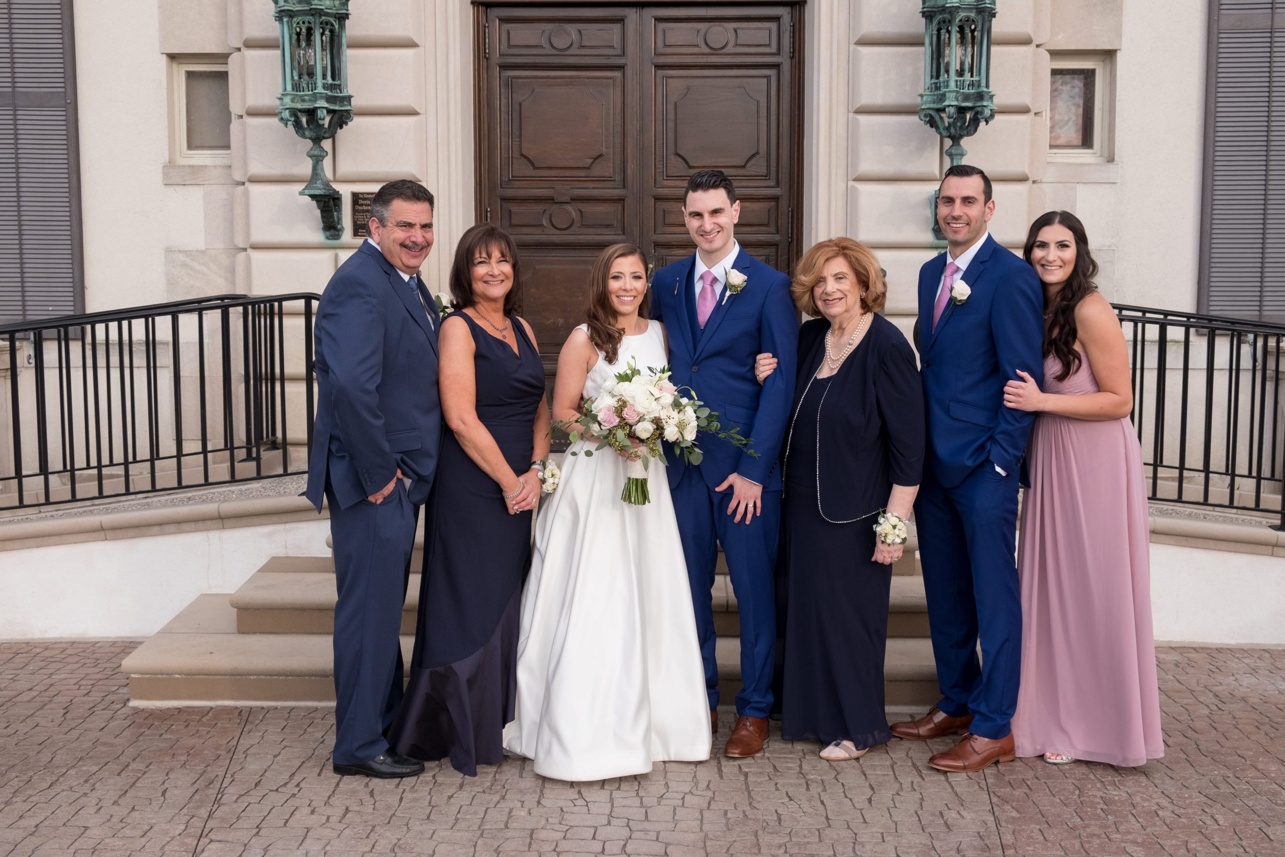 family formal wedding photos at ceremony site