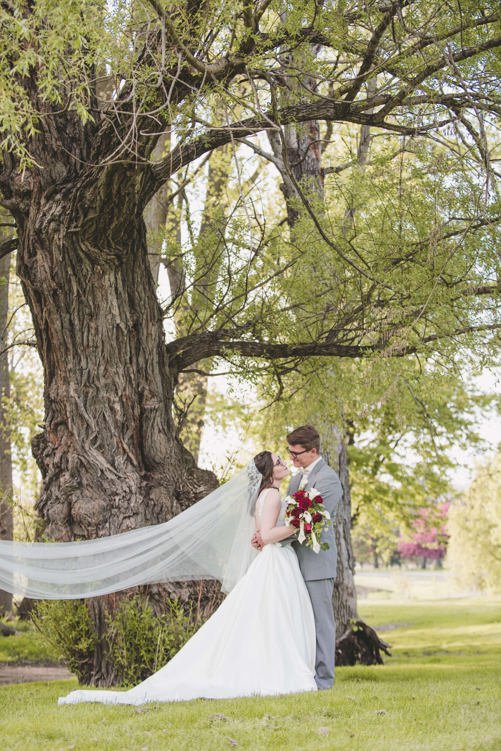 bride and groom wedding veil flowing