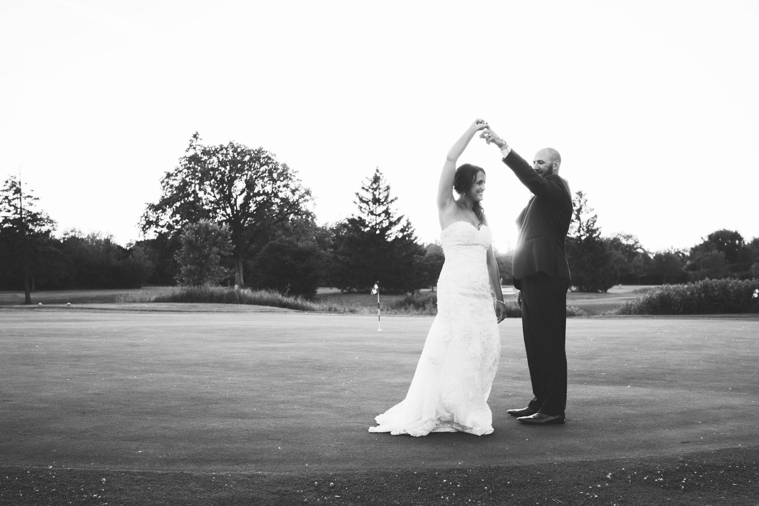 bride and groom romantics on golf course