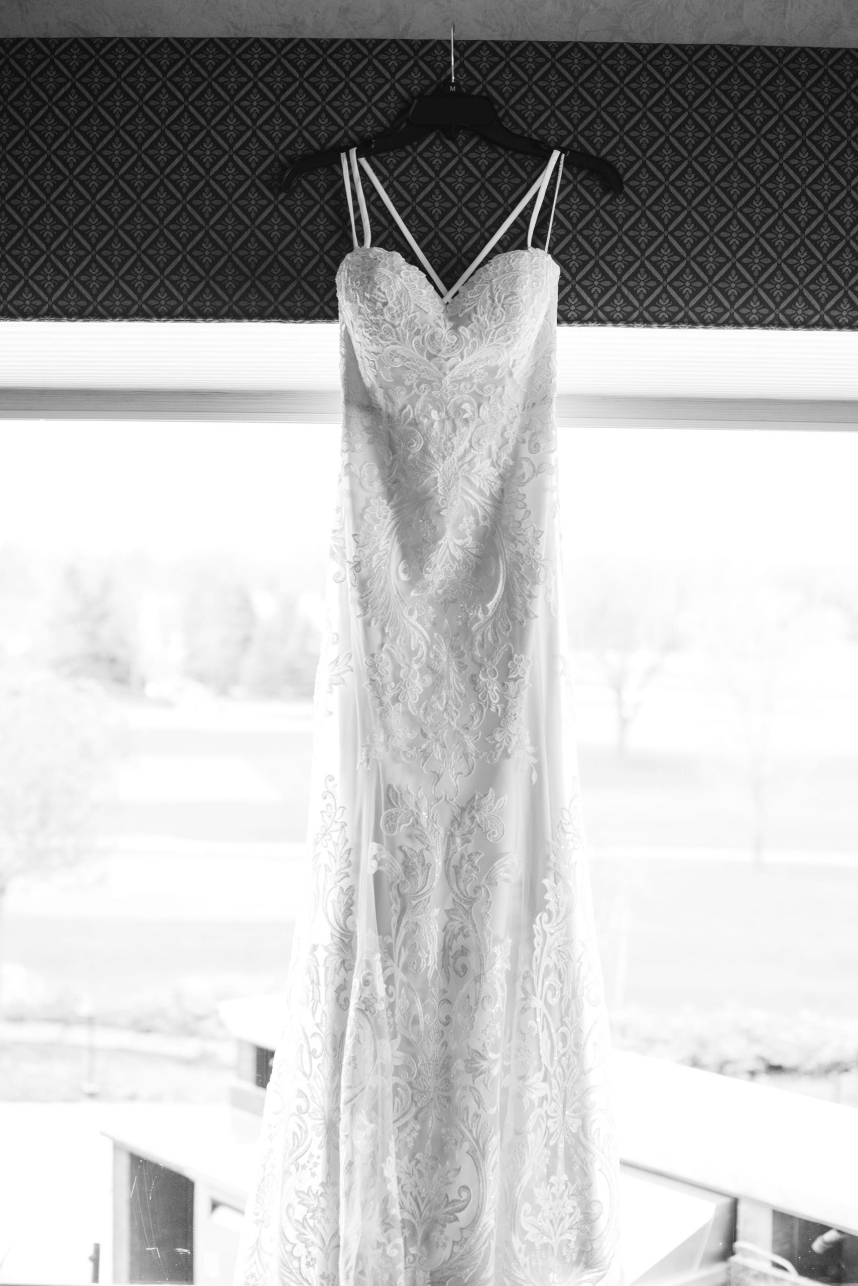 dress hanging from window