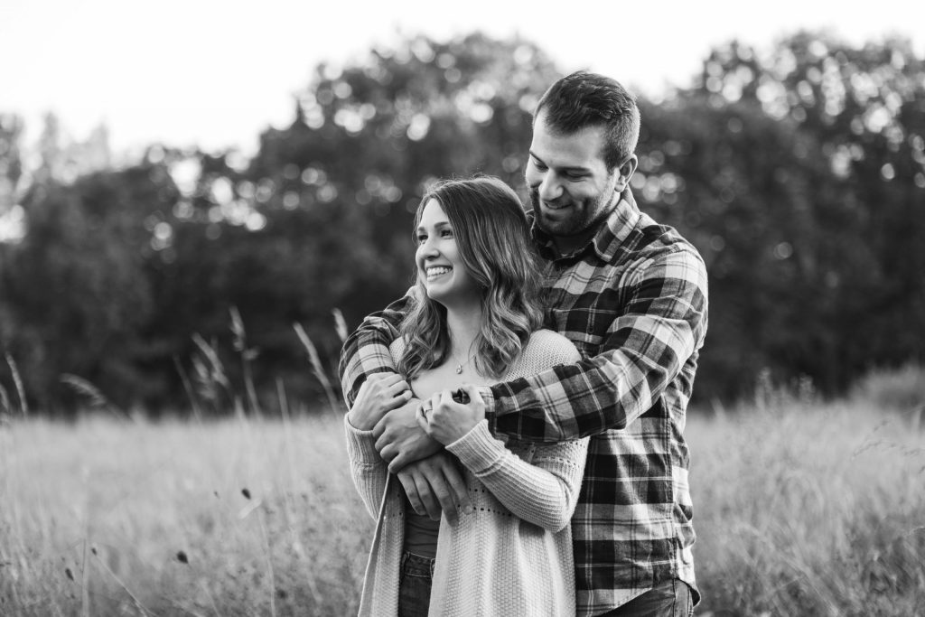 black and white engagement session in field