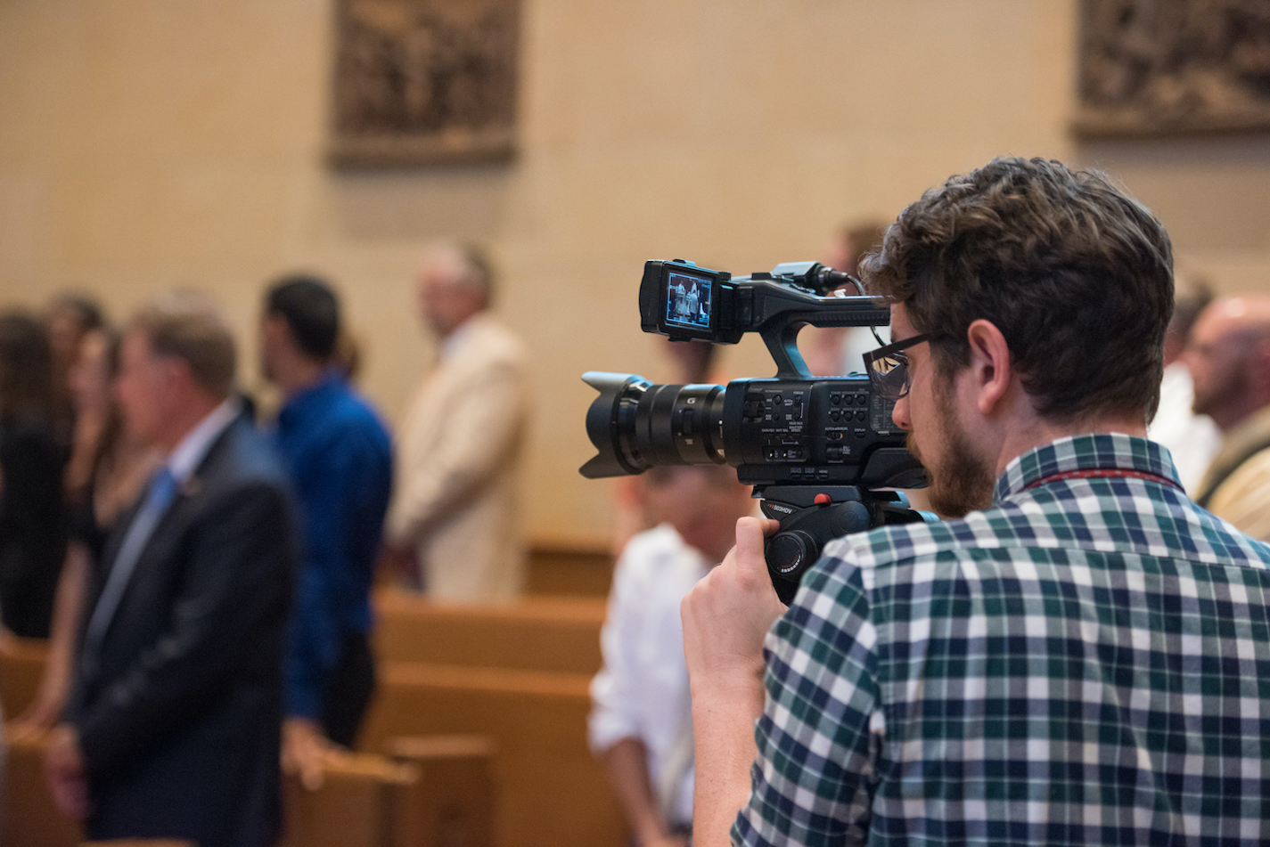 Videography filming church wedding ceremony