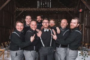 groomsmen at barn wedding