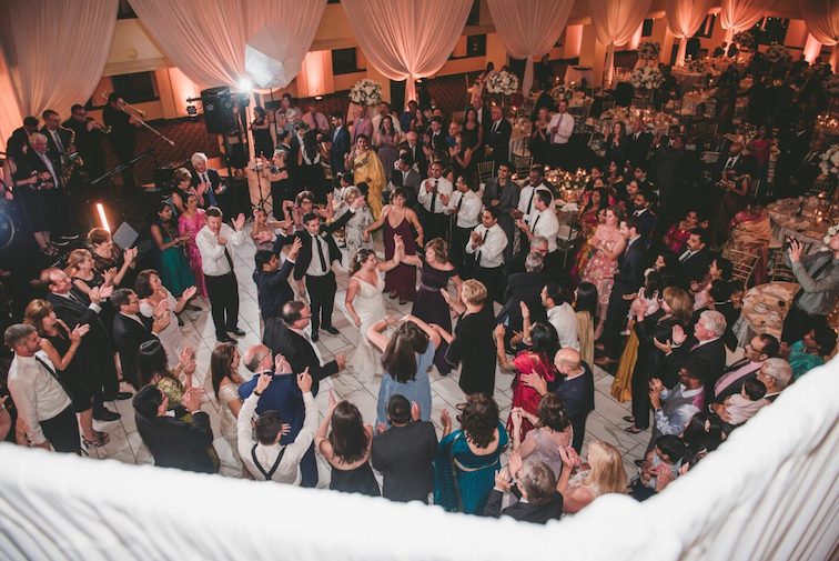 packed dance floor at wedding reception