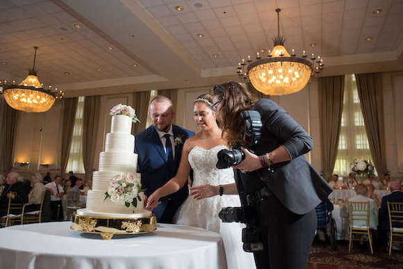 photographer setting up cake cutting shot wedding photography questions
