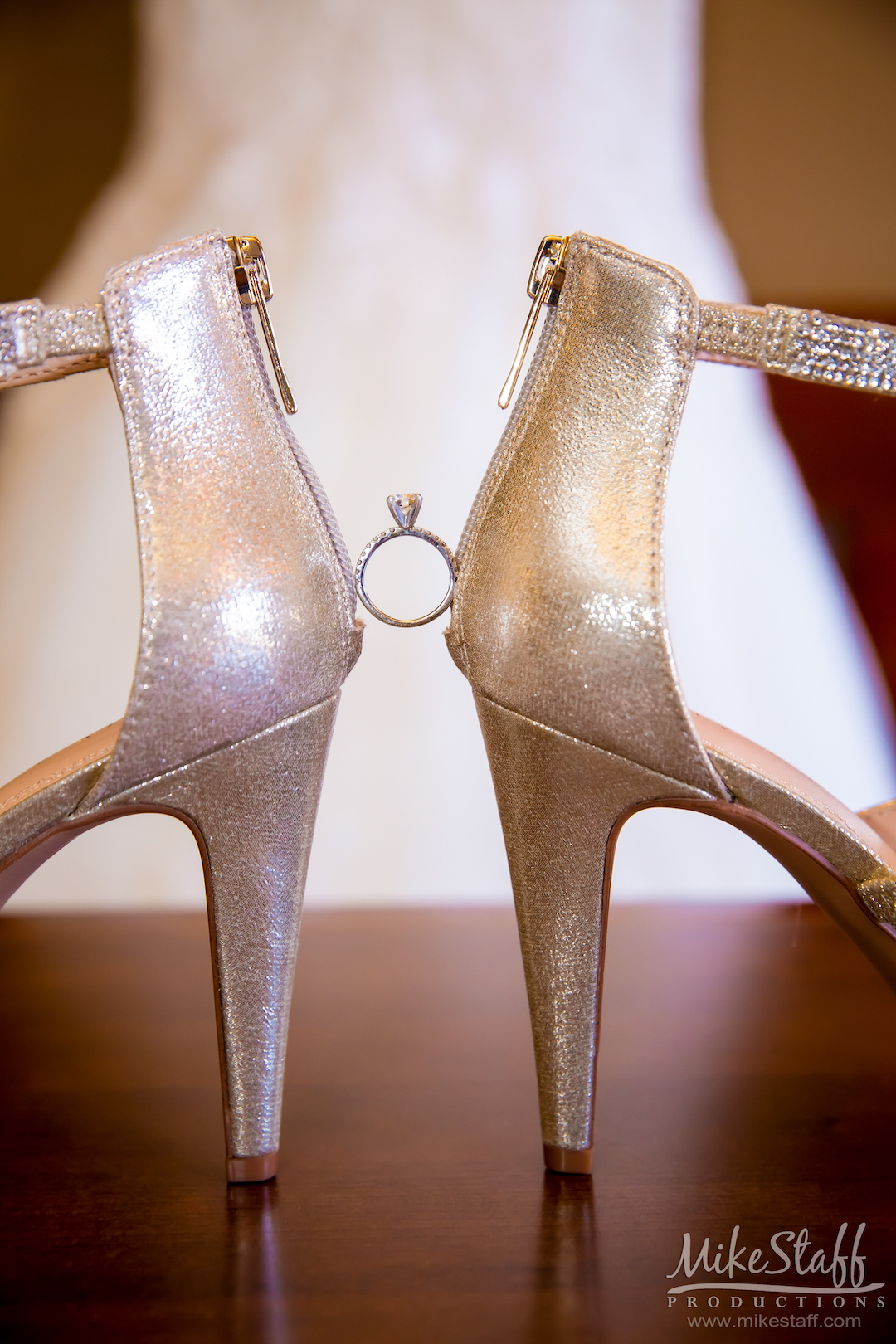 ring between bride's heels