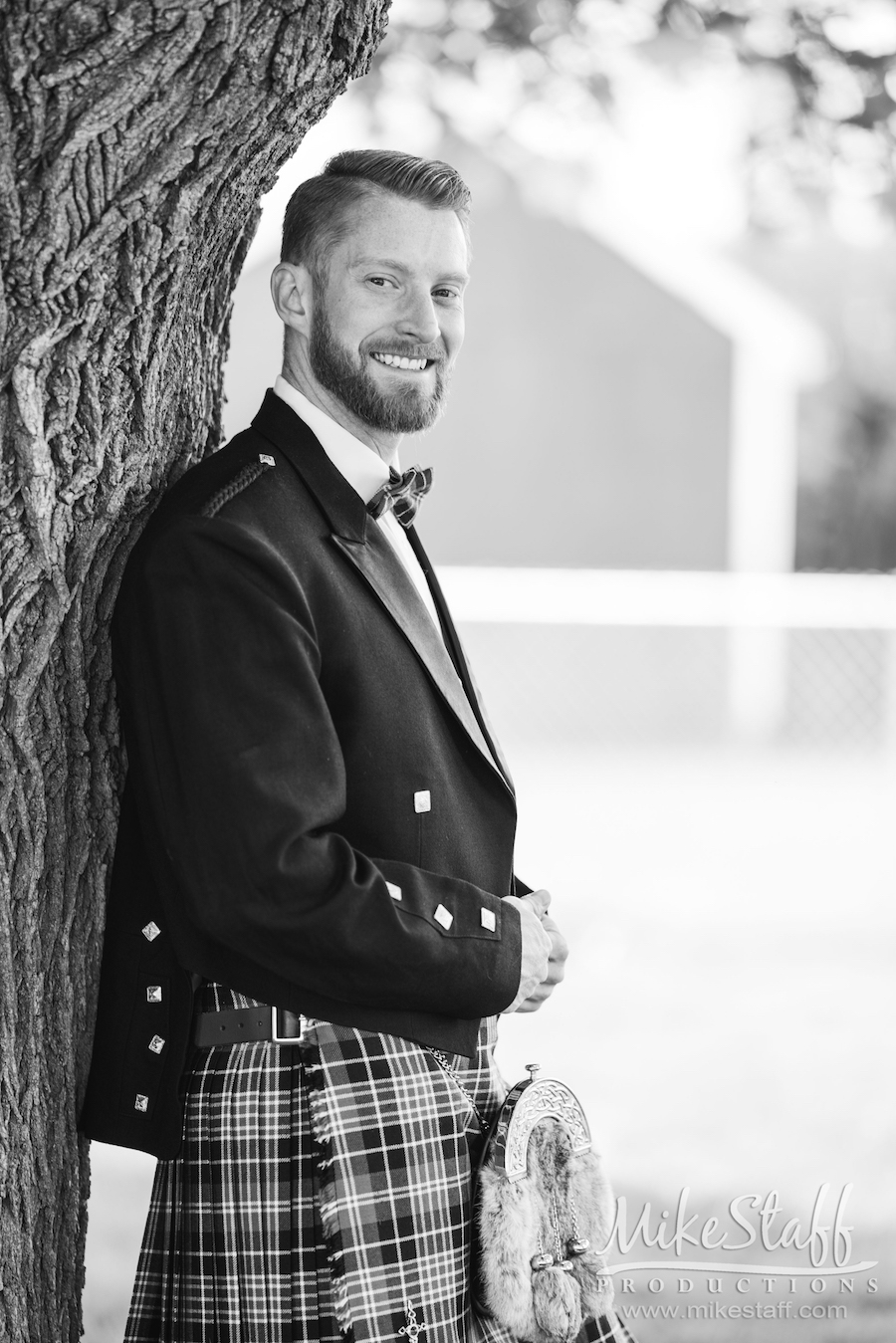groom Garret black and white in kilt outdoor black and white photography