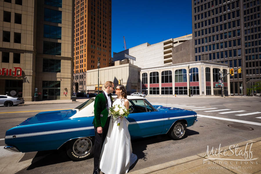 bride and groom outside of classic car detroit