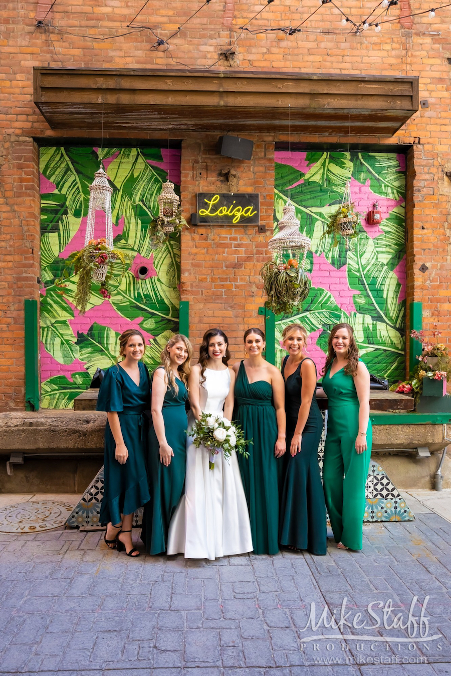 bride kylie and bridesmaids green dresses