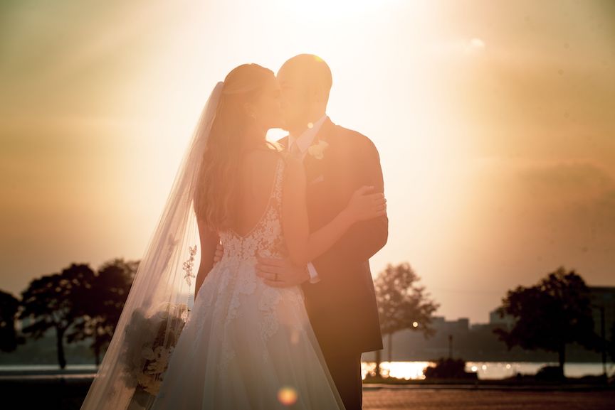 sunset kiss bride and groom