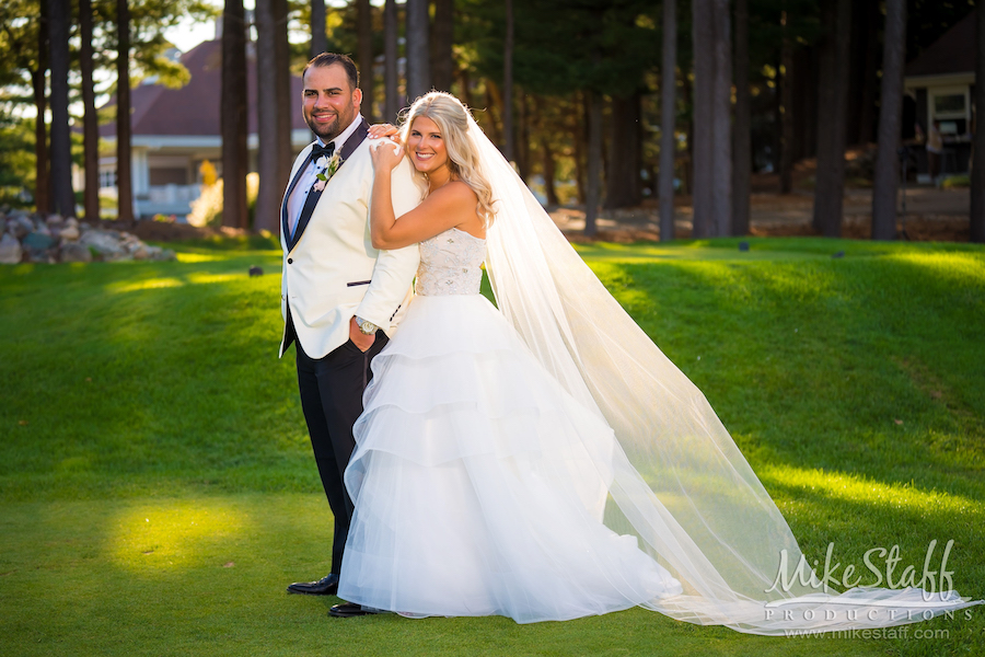 bride and groom romantics on golf course at oakhurst
