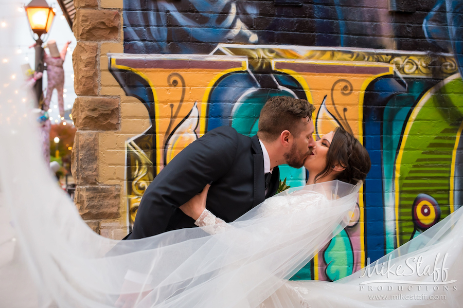 downtown holly graffiti groom dipping bride