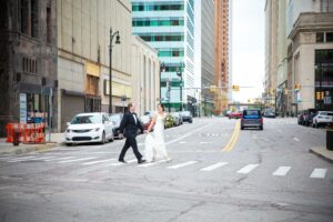 Amanda & Andrew crossing street in Detroit