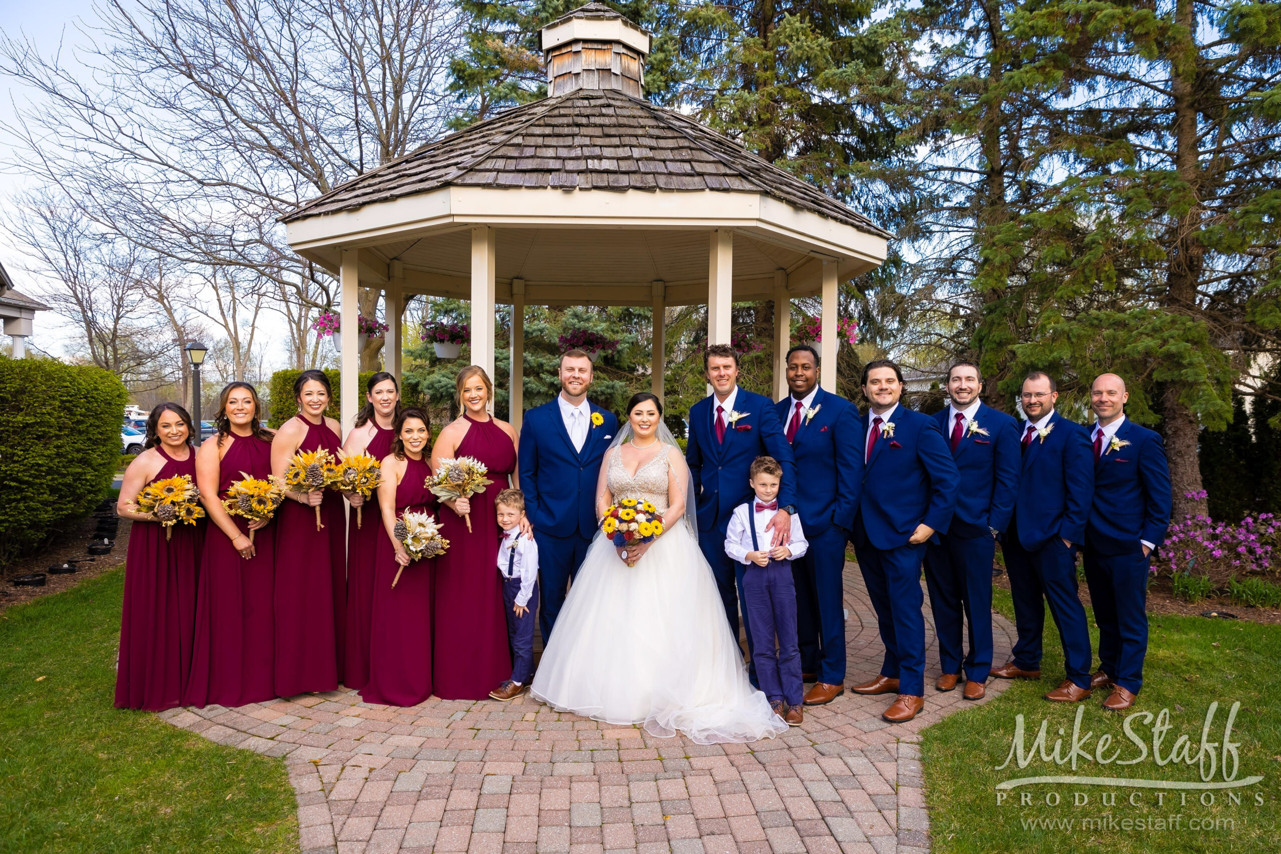bridal party in front of gazebo