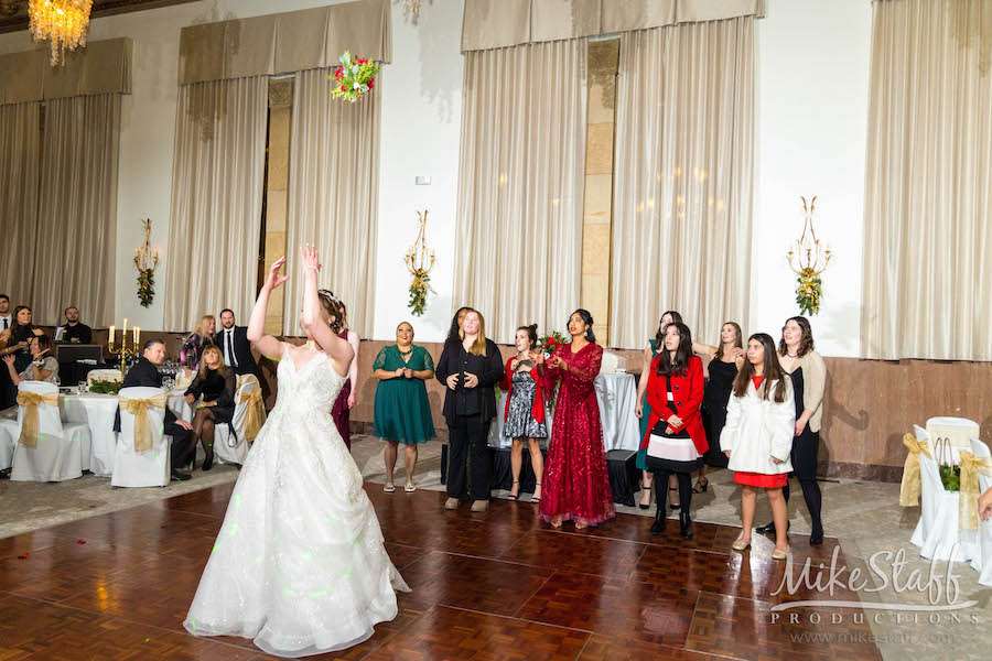bride tossing bouquet at saint john's ballroom