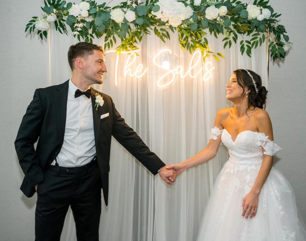 neon sign with bride and groom wedding photo booth alternatives