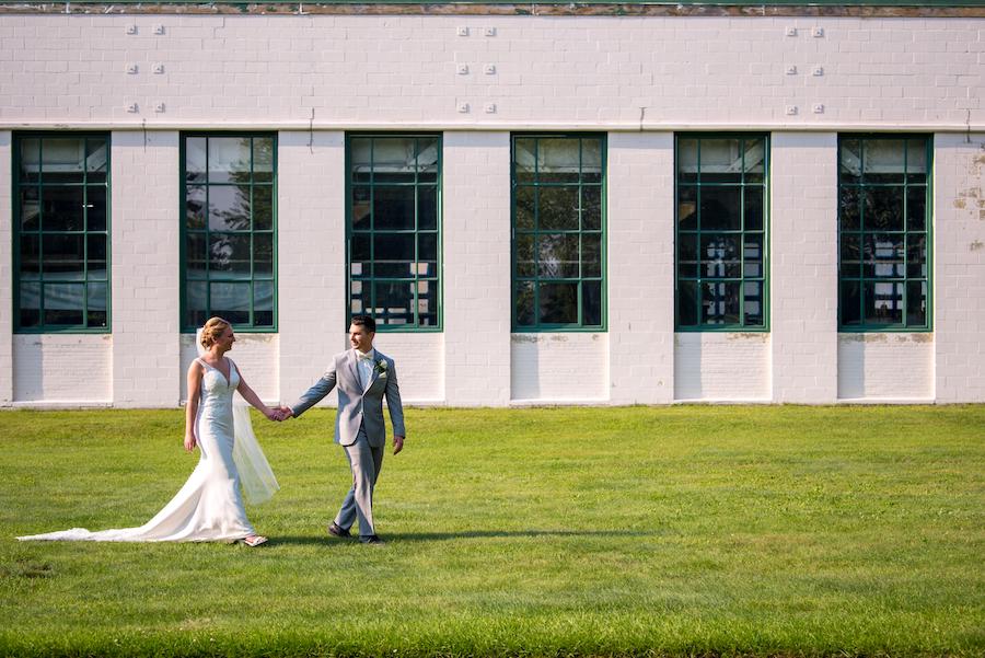 Detroit Wedding Photography at The Packard Proving Grounds_bride and groom walking outside