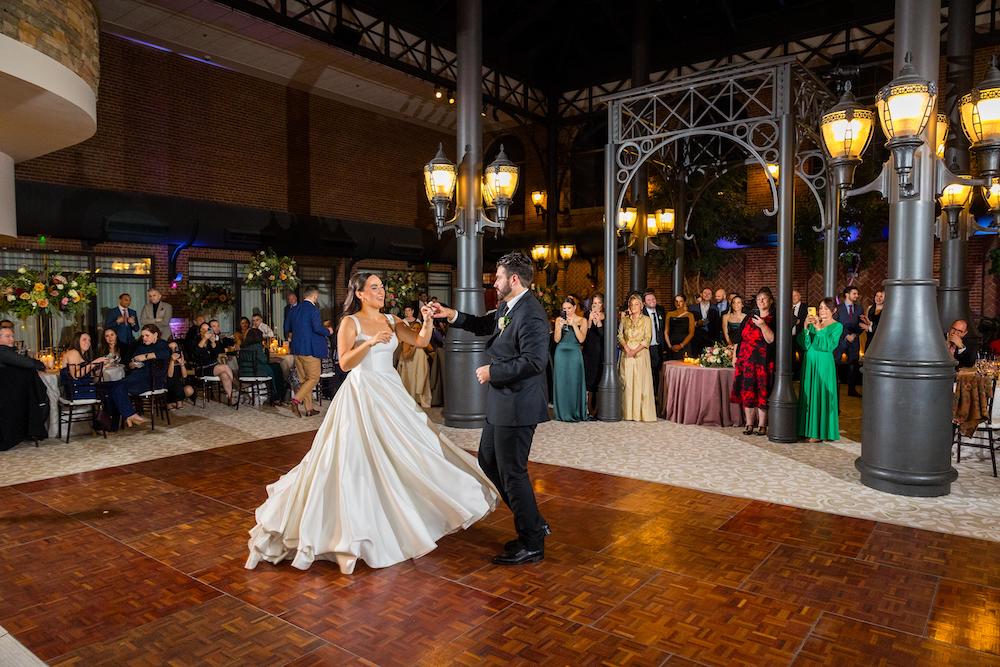 Wedding Photographers at Saint Johns Resort_bride twirling on dancr floor first dance