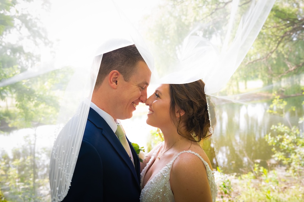 veil over bride and groom_Detroit Wedding Photography_Mike Staff Productions_Golden Hawk